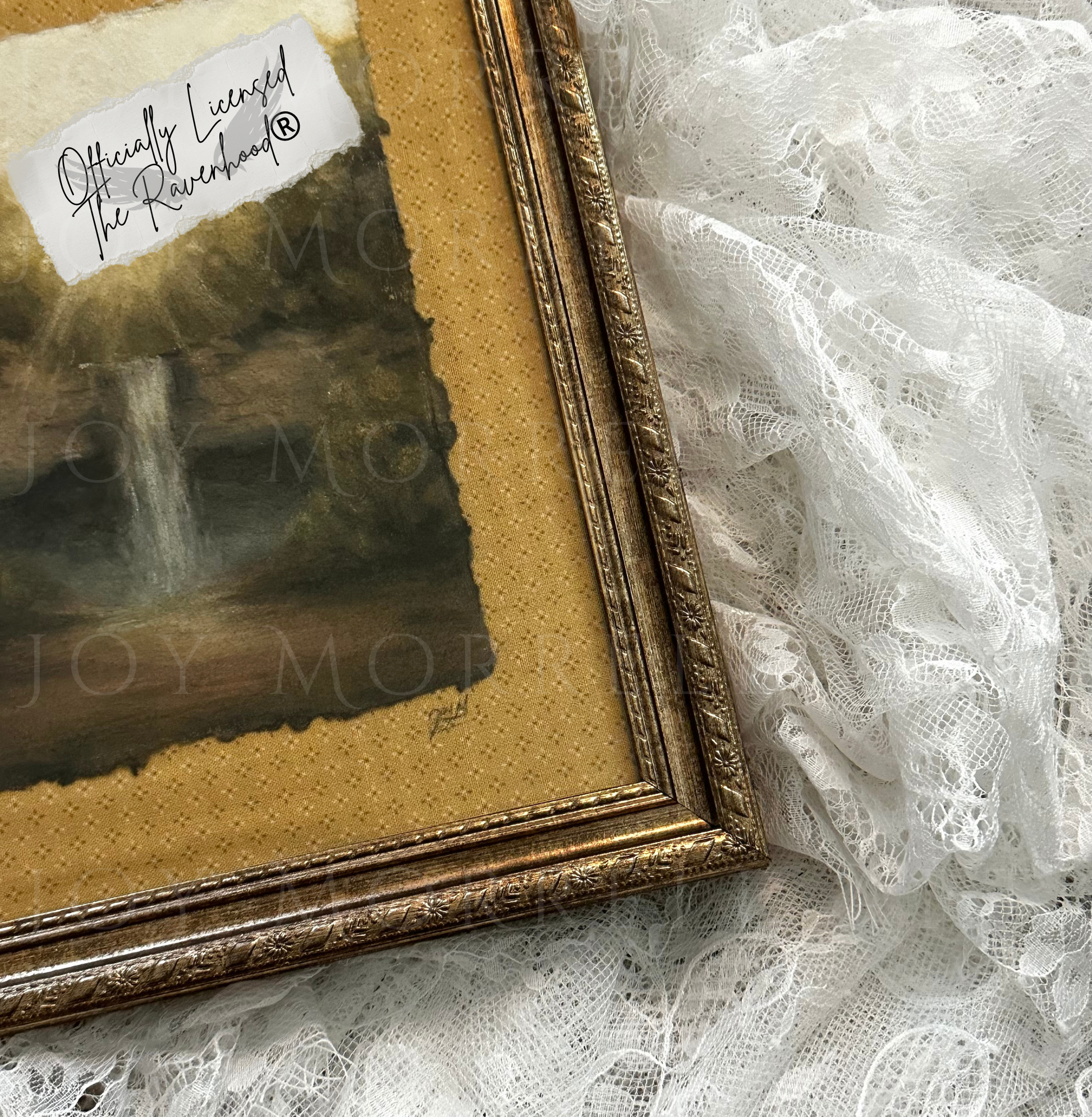 Gold-framed picture with 'Officially Licensed' label on a lace background