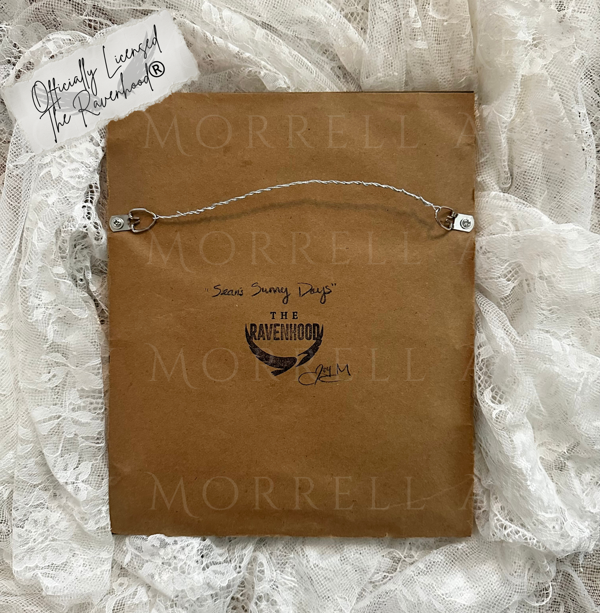Brown paper bag with 'Morrell' branding on a lace background